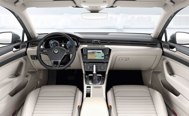 the interior of a car with beige leather seats