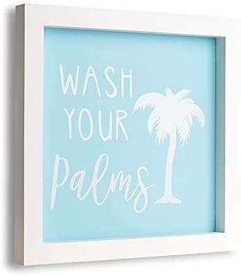 a white frame with a palm tree and the words wash your palms written on it