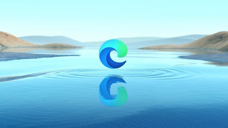 a blue and green logo floating on top of a body of water with hills in the background