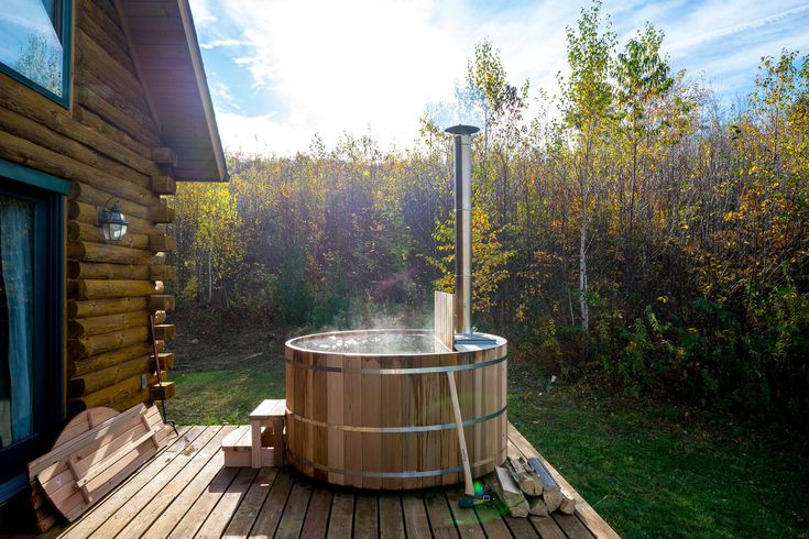 a hot tub sitting on top of a wooden deck