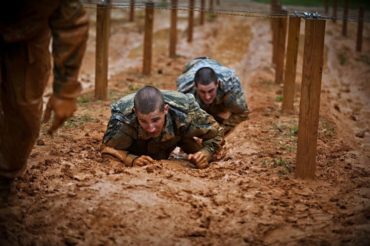 U.S. Army Soldiers from the One Station Unit Training (OSUT) low crawl while negotiating an obstacle course during their first week of Basic Training in Ft. Benning, Ga. March 9, 2012. OSUT is a training program in which recruits remain with the same unit for both Basic Combat Training (BCT) and Advanced Individual Training (AIT). Fort Benning Georgia, Military Brat, Fort Benning, Army Soldiers, Basic Training, Combat Training, Joining The Army, Military Training, Military Love