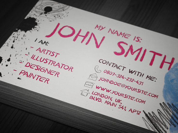 the business card is designed to look like it has been painted with black and pink ink