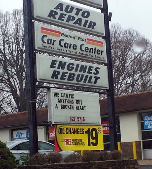 a car repair sign in front of a building