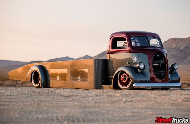 an old truck is parked in the desert