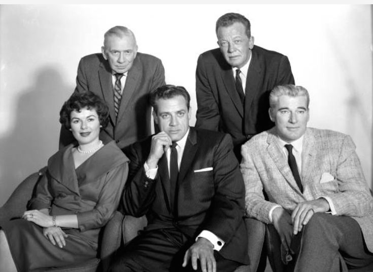 an old black and white photo of five people