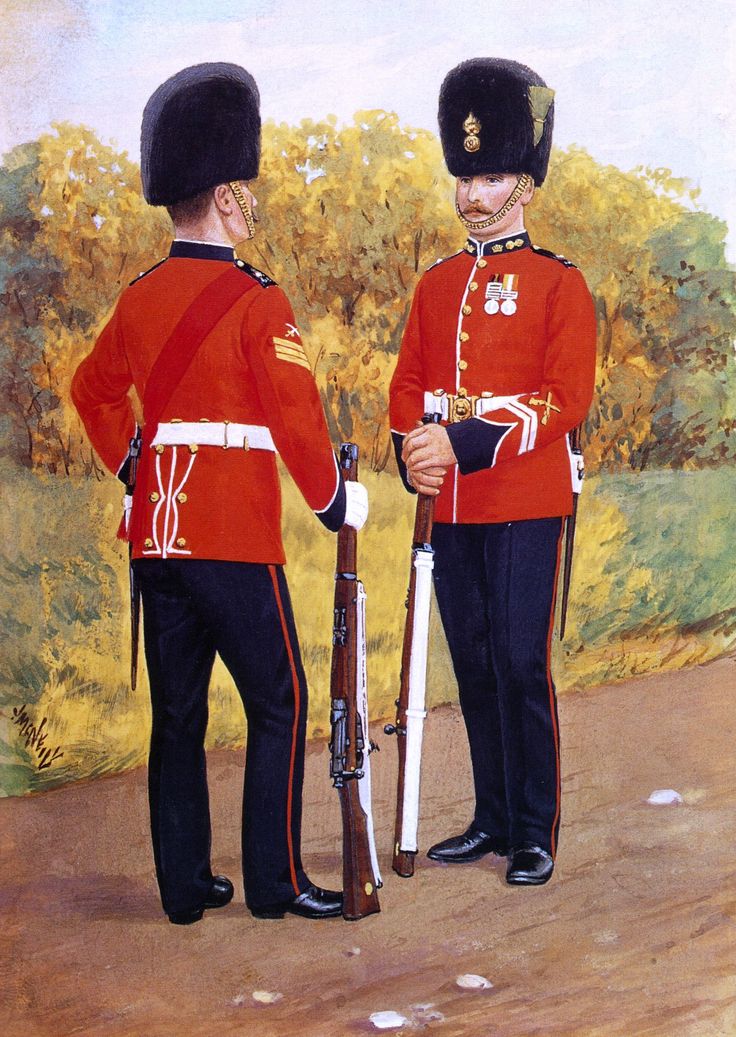 two men in red uniforms standing next to each other