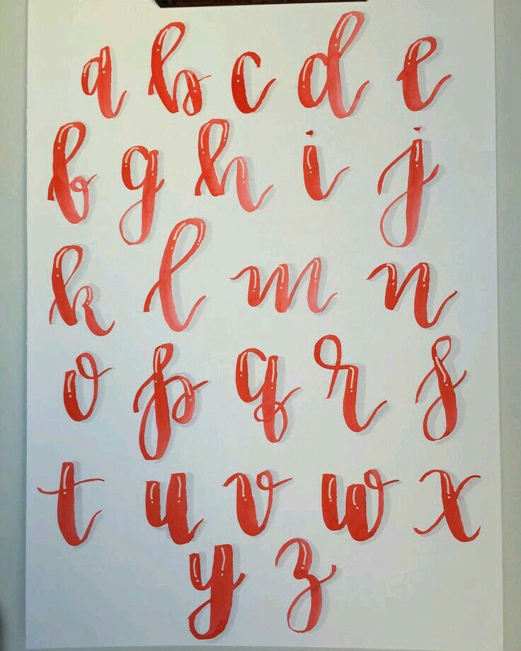 the letters and numbers are drawn in red ink on white paper with a black marker