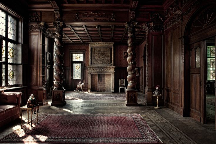 an old fashioned living room with wood paneling