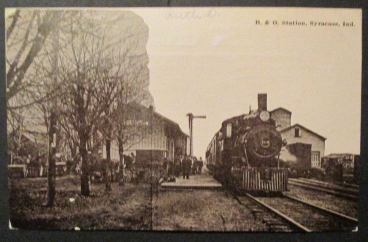 an old black and white photo of a train on the tracks