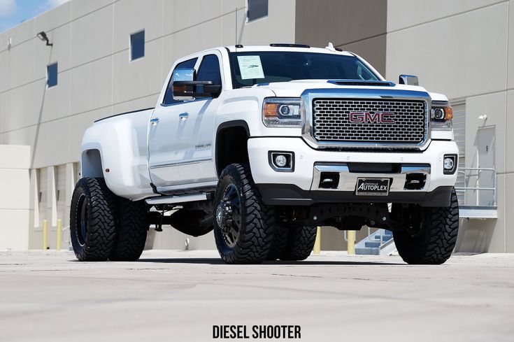 a white truck parked in front of a building