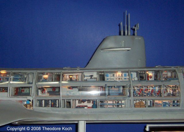 a model of a submarine on display in a museum case at the national air and space museum