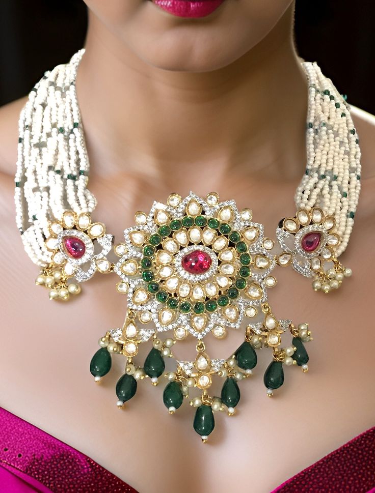 Pretty fine Pachi Kundan choker with Emerald/Ruby colored stones and Green Onyx beads and matching earrings Dimension: 9" end to end length, pendant size: 1.5" x 2.5" wide Earrings: 2.5" long Weight: 2.8 oz, w/ packaging: 3.6 oz Diwali Kundan Beaded Choker, Bollywood Beaded Choker For Diwali, Bollywood Beaded Celebration Choker, Bollywood Beaded Choker For Celebration, Bollywood Style Beaded Celebration Choker, Bollywood Style Beaded Choker For Celebration, Traditional Bridal Necklace With Colorful Beads For Festive Occasions, Traditional Stone Work Choker For Reception, Traditional Bridal Necklace With Colorful Beads