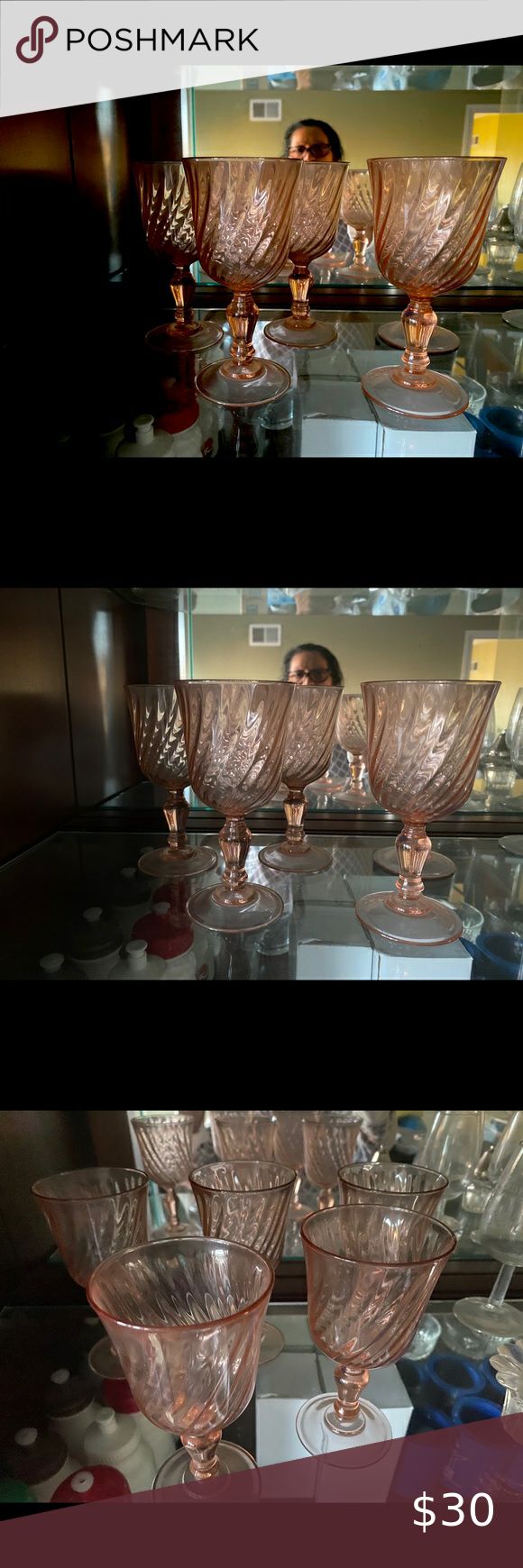 there are three glass bowls on the shelf in front of each other and one is empty