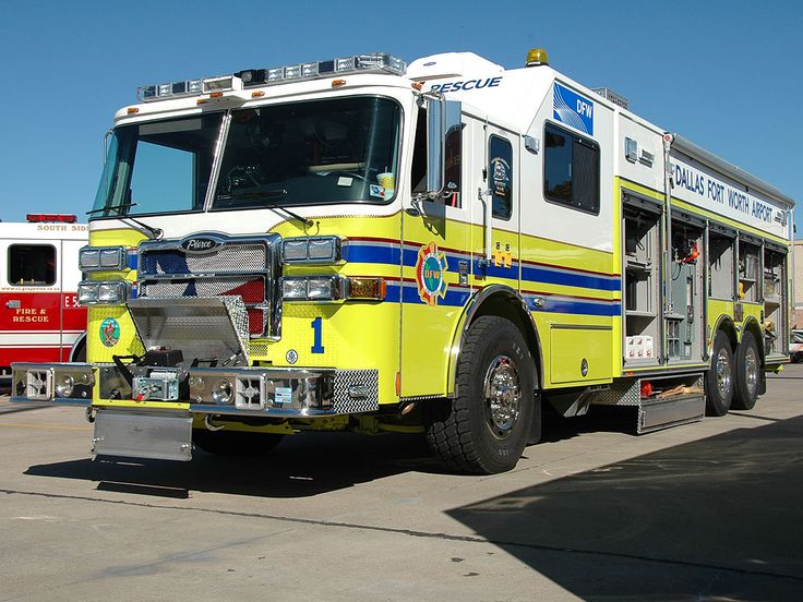 two fire trucks parked next to each other in a parking lot