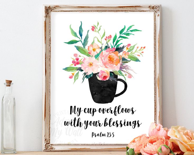 a framed print with flowers and bible verse on the wall next to a vase full of flowers