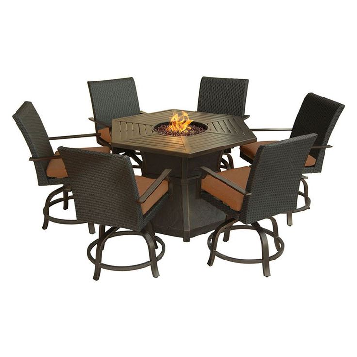 an outdoor fire pit table with chairs around it and the fire burning in the center