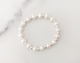 Swarovski Crystal Pearl and Crystal Bangle Set | Etsy Everyday Silver Beaded Bracelet With Pearl Charm, Silver Beaded Pearl Stretch Bracelet, Dainty Silver Stretch Bracelet Gift, Silver Spiritual Stretch Bracelet Stackable, Silver Pearl Stretch Bracelet Gift, Silver Stackable Pearl Bracelet With Round Beads, Silver Pearl Stretch Bracelet As Gift, Pearl Stretch Bracelet With Spacer Beads As Gift, Silver Stackable Pearl Bracelet Gift