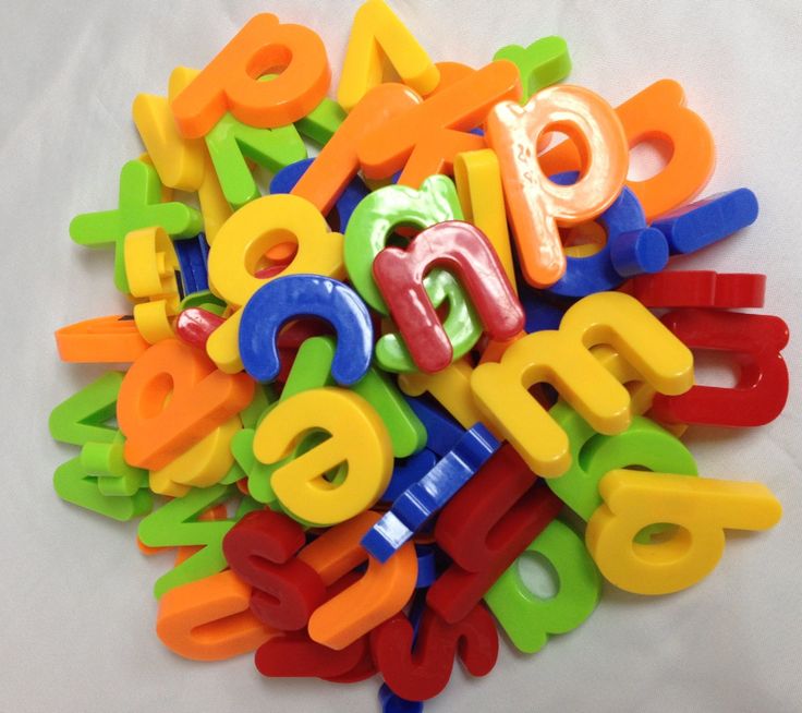 a pile of multicolored plastic letters and numbers