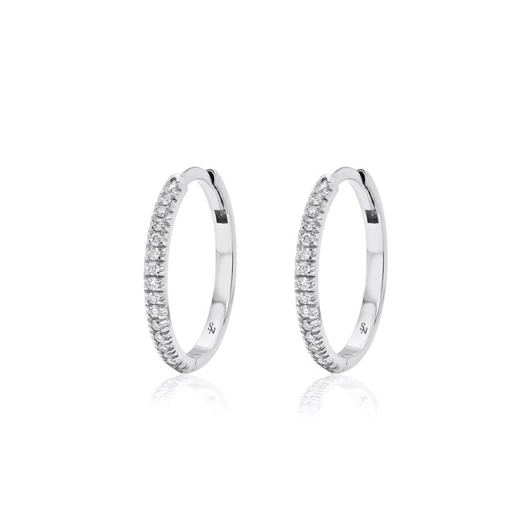 The largest size in our signature huggie series 15 mm Solid 18K Gold 16 round 1.1mm brilliant diamonds on each hoop, VS quality, G/H Color. TCW = 0.16 cts per hoop Hinged opening with hidden post closure Sold as a pair Everyday Round Huggie Earrings With Diamond Accents, Small Hoop Brilliant Cut Hoop Earrings In White Gold, Timeless Huggie Diamond Earrings With Single Cut, Small Hoop Diamond Earrings In White Gold, Timeless Small Hoop Earrings With Single Cut Diamonds, Diamond Huggie Earrings With Halo Design, Timeless Small Hoop Diamond Huggie Earrings, Small Diamond Hoop Earrings With Halo Design, Timeless Small Hoop Earrings With Diamond Accents