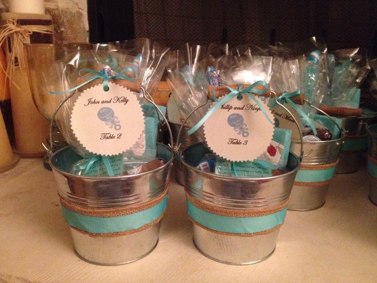 several small buckets filled with baby shower items