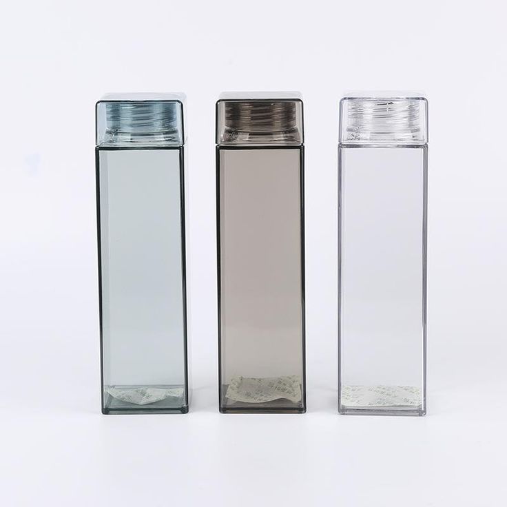 three different sized glass bottles with silver lids