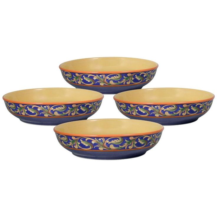 four blue and yellow bowls with designs on them