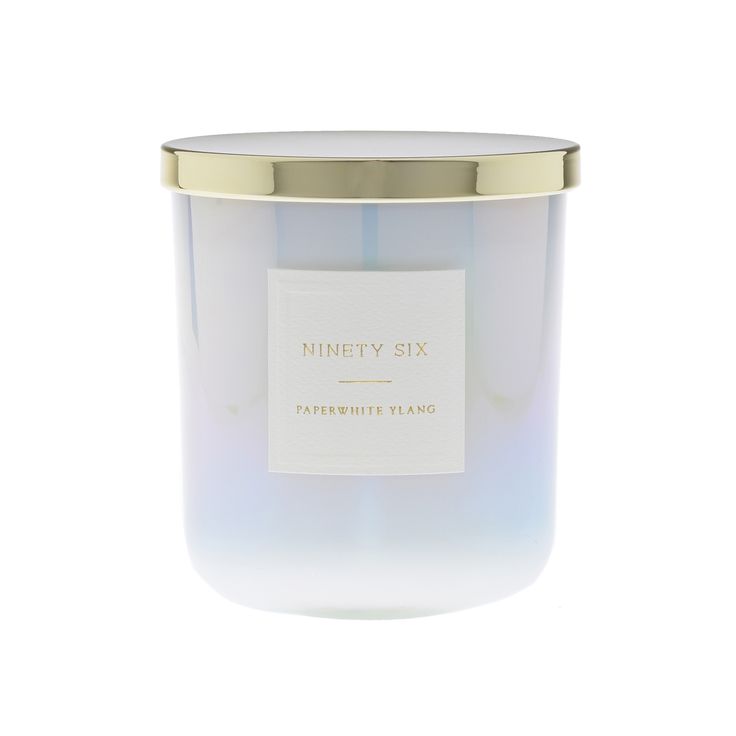 a candle with a label on it sitting in front of a white background that says ninety six