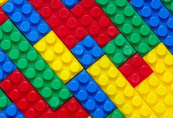 many different colored legos are arranged in the shape of a rainbow - striped pattern