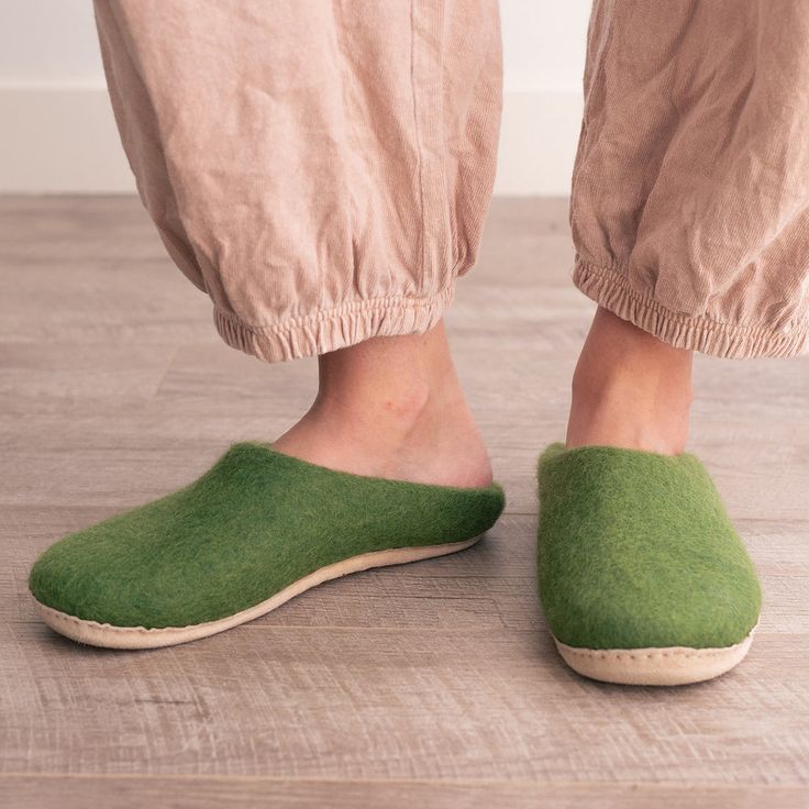 Experience Unparalleled Comfort with Our Handcrafted Wool SlippersWrap your feet in the warmth and luxury of our meticulously crafted wool slippers, designed with your comfort and sustainability in mind. Made from 100% organic merino wool, these slippers offer a cozy embrace for tired feet, making them perfect for rela Green Comfortable Slippers With Textured Footbed, Casual Wool Slippers With Leather Sole, Winter Wool Slippers With Cushioned Footbed, Wool Slippers With Cushioned Footbed For Winter, Comfortable Wool Slip-on Slippers, Comfortable Natural Slippers With Rubber Sole, Wool Slippers With Leather Sole For Winter, Winter Wool Slippers With Rubber Sole, Comfortable Wool Slippers For Indoor Use