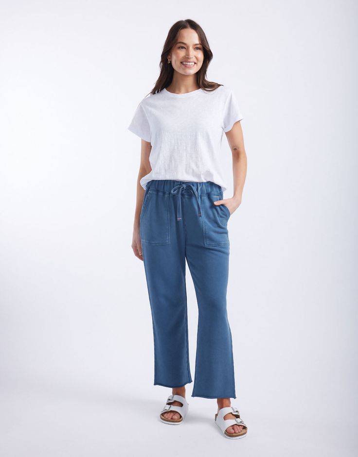 DESCRIPTION Elevate your casual wear with the Raw Edge Lounge Pant in Denim by White & Co. The Label. These lounge pants are designed for ultimate comfort and style, featuring a relaxed fit with a drawstring waist and raw edge hem. The soft denim colour adds a modern touch, while the large front pockets provide both practicality and a chic look. Perfect for lounging at home or running errands, these French Terry pants will become your go-to for effortless, laid-back style. Pair the Raw Edge Loun Denim Colour, French Terry Pants, Laid Back Style, Colored Denim, Denim Pant, Lounge Pants, Raw Edge, Running Errands, Effortless Style