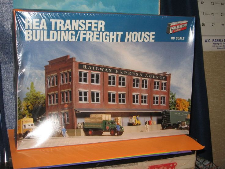 a box with an image of a building on the front and side of it that says real transfer building / freight house