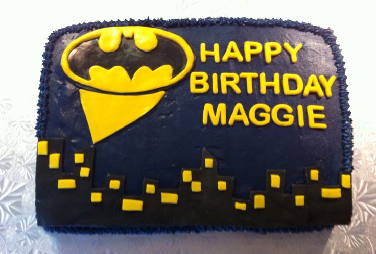 a batman birthday cake with the words happy birthday maggie on it's side