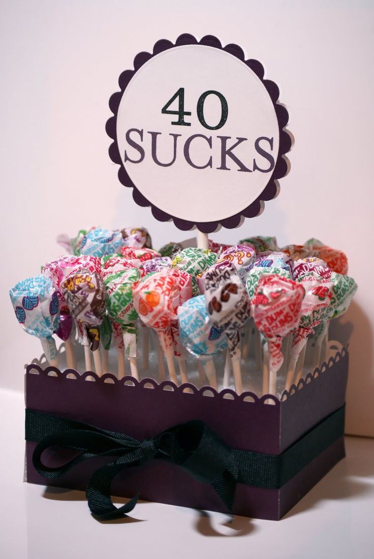 a bunch of lollipops sitting in a box on top of a table