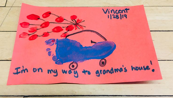 a child's handmade card with an image of a blue scooter