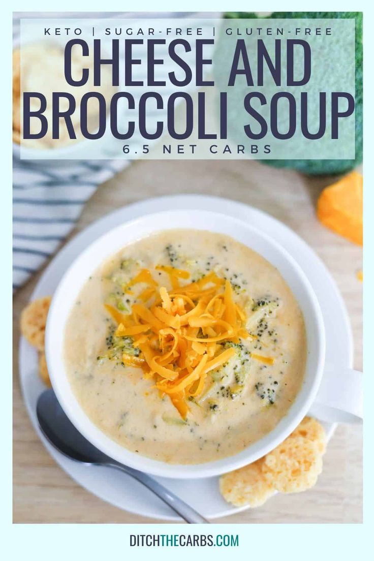 cheese and broccoli soup in a white bowl with crackers on the side