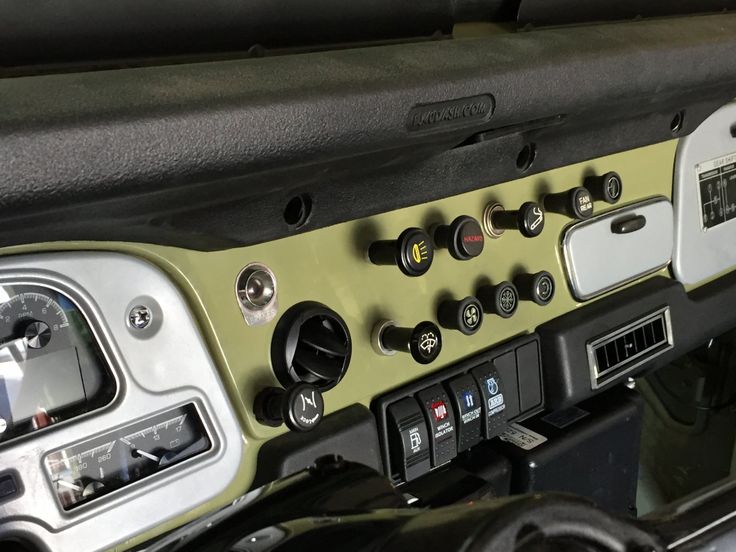 the interior of a vehicle with buttons and controls