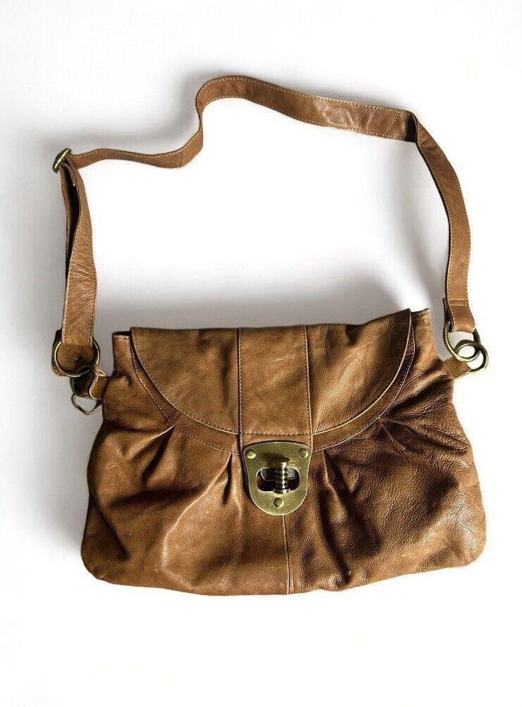 This vintage Aldo women's shoulder handbag is a stylish addition to any wardrobe. Crafted from high-quality leather, this medium-sized bag is perfect for everyday use. The exterior features a beautiful brown color that complements any outfit, making it a versatile accessory. The bag is designed with a shoulder strap for easy carrying and comes in a stylish Aldo brand. It's perfect for women who want a chic and practical accessory. Whether you're running errands or going out for a night on the town, this bag is sure to impress. Please look at the pictures for sone flaws and also inside bag theres a minor stain that can potentially be cleaned but I didnt try. Message me if you have any questions. Medium Sized Bags, Inside Bag, Sling Bags, Handbag Women, Outfit Making, Shoulder Handbag, Hobo Bag, High Quality Leather, Shoulder Handbags