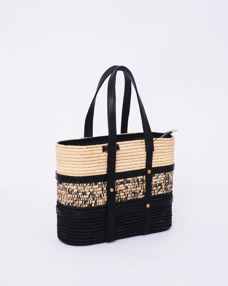 this stunning raffia handmade bag to our customers. This versatile bag can be used as both a shoulder bag and a handbag, making it the perfect accessory for any woman. The natural and eco-friendly raffia material used in this bag makes it a great choice for those who value sustainability. The bag comes in natural raffia color and black , so you can choose the one that best suits your personal style. Our skilled artisans have crafted this bag with traditional techniques and attention to detail, e Chic Woven Leather Bags For Market, Black Woven Beach Bag Made Of Natural Fiber, Black Crochet Bag With Woven Leather For Everyday Use, Chic Woven Leather Straw Bag For Market, Rectangular Black Straw Bag With Woven Leather, Black Rectangular Straw Bag With Woven Leather, Chic Straw Bag With Woven Leather For Market, Black Woven Leather Straw Tote Bag, Black Woven Leather Straw Bag For Daily Use