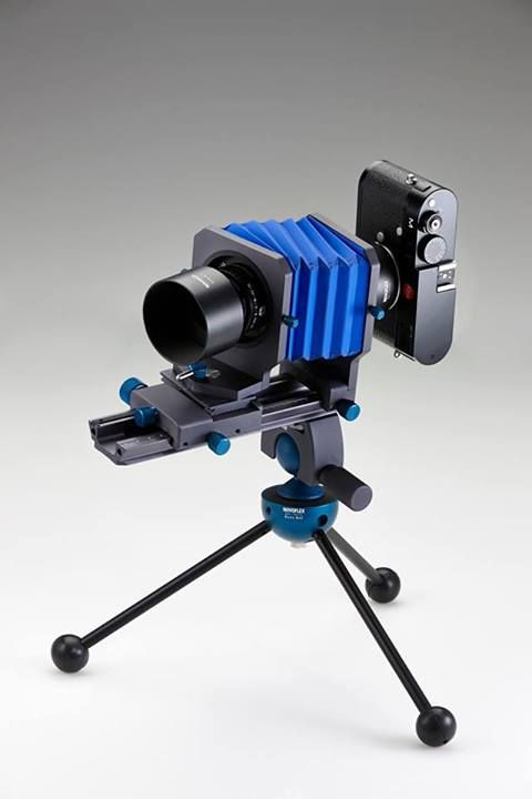 a small camera sitting on top of a tripod