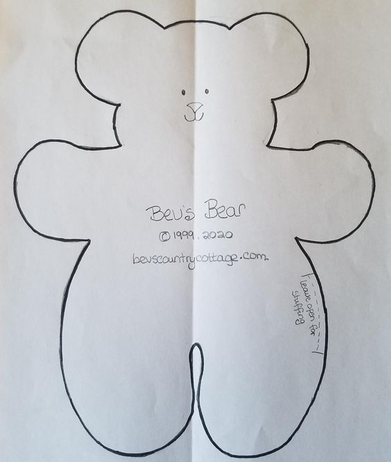 a paper cut out of a teddy bear with writing on the front and back side