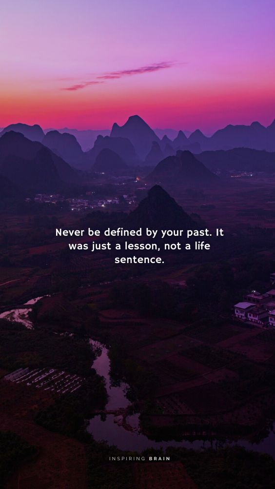 an aerial view of mountains with a quote on the top that says never be defined by your past it was just a lesson, not a life