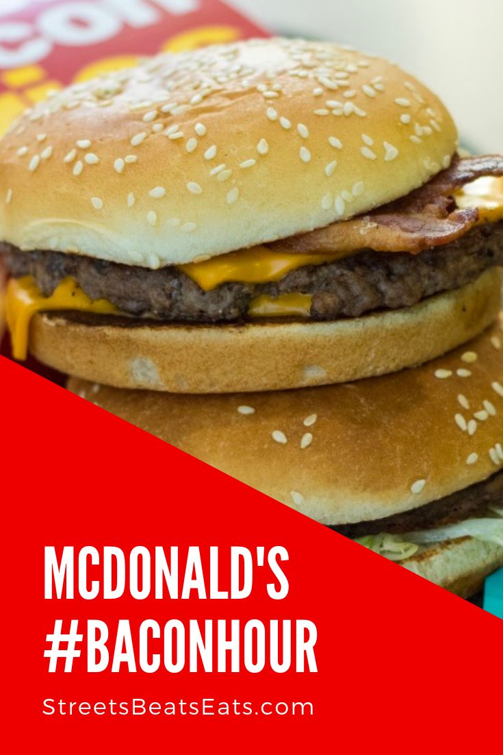 the mcdonald's bacon hour burger is stacked on top of each other with cheese