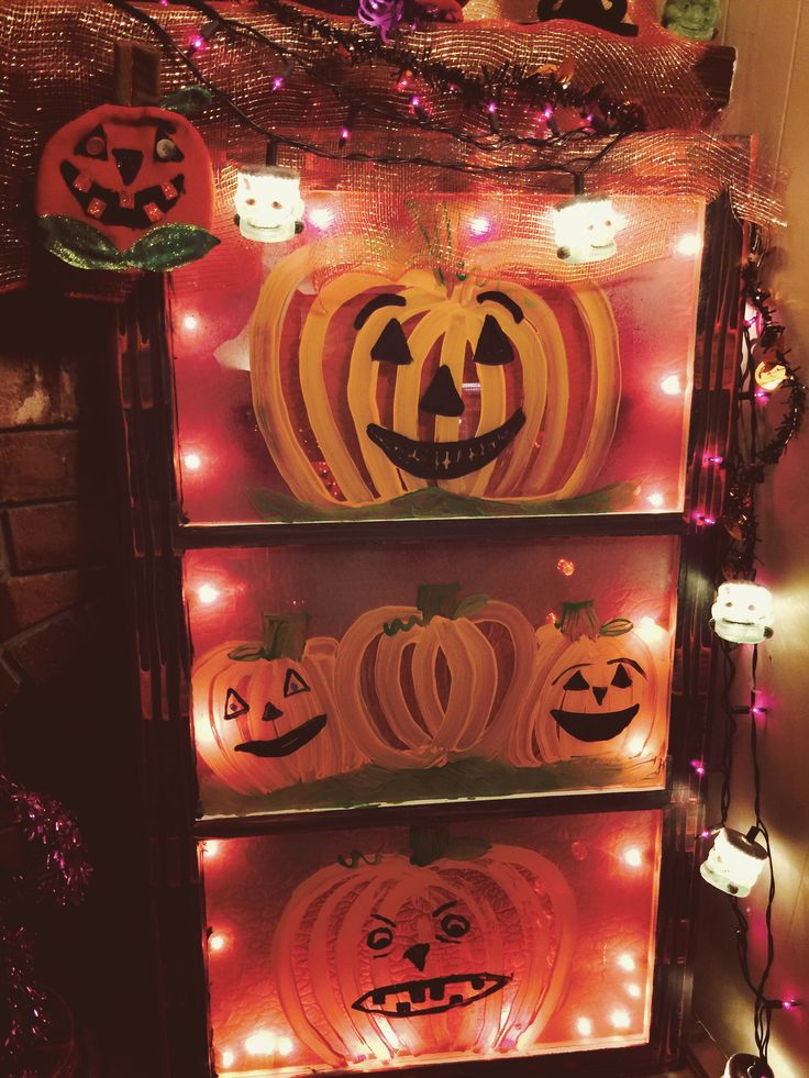 lighted pumpkins and jack - o'- lanterns are on display in this room