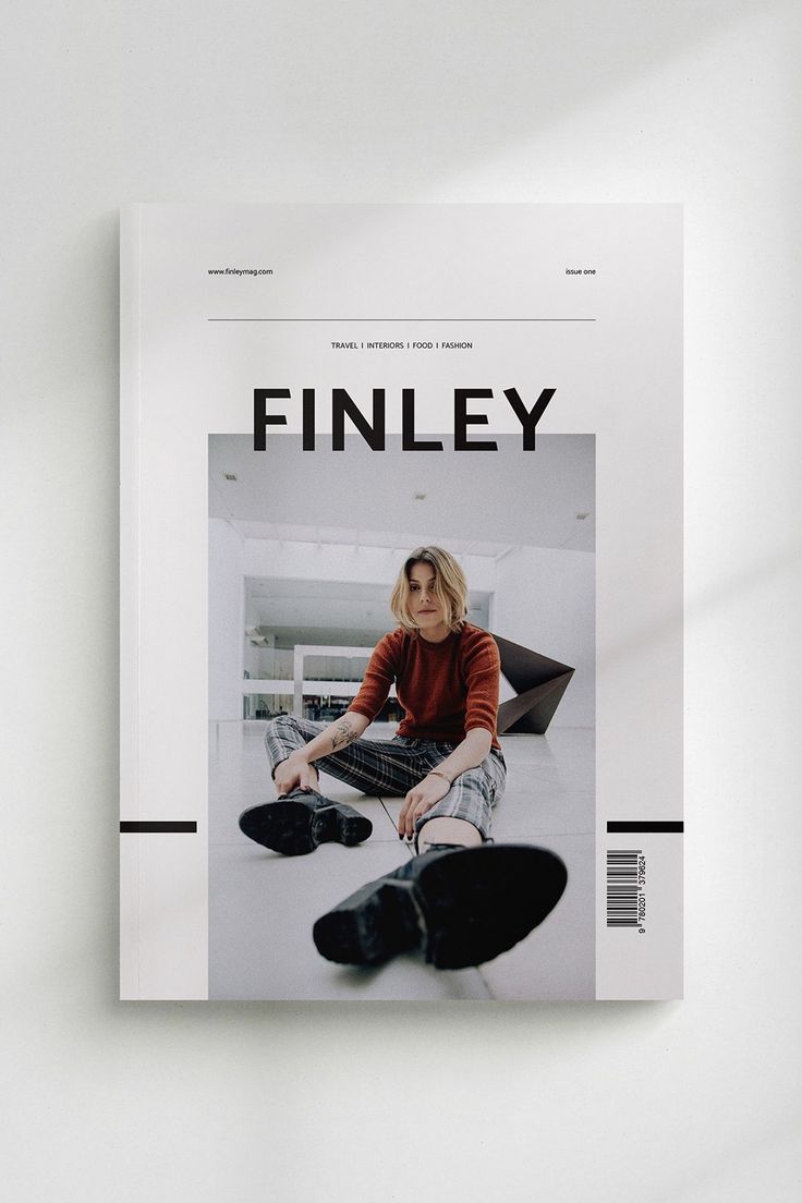 a magazine with an image of a woman sitting on the floor