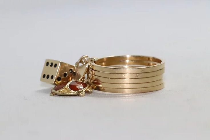 Highlighting astonishing vintage 14 KT yellow gold stack-able ring with beautiful ladybug and dice charms. This ring has a size 5.5, weighs at 5.1 grams and been hallmarked 14 KT yellow gold. Lastly, the ring has been checked by a professional for authenticity. Vintage 14k Gold Stackable Jewelry, Vintage Stackable 14k Gold Jewelry, Vintage Yellow Gold Stackable Jewelry, Stackable Rings, Gold Rings, Yellow Gold, Yellow, Etsy Uk, Gold