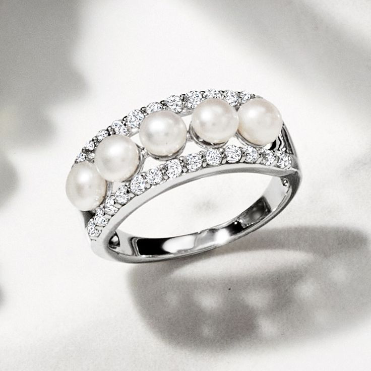 Ross-Simons - 4.5mm Cultured Pearl, .70ct t. w. White Topaz Ring in Silver. Size 6. Glisten and gleam with this nicely priced statement ring! A lustrous row of 4.5mm cultured freshwater button pearls is nestled between .70 ct. t. w. round white topaz borders, all set in polished sterling silver. 1/4" wide. White topaz and white pearl ring. Pearl birthstones are the perfect gift for June birthdays. Diamond Pearl Ring With Prong Setting For Anniversary, Pearl Ring With Prong Setting For Anniversary, Anniversary Pearl Ring With Diamond In Prong Setting, Round Cut Diamond Pearl Ring For Anniversary, Diamond Pearl Ring For Anniversary, Diamond Pearl Ring For Anniversary With Round Band, Diamond White Pearl Ring With Diamond Accents For Promise, Diamond White Pearl Ring With Diamond Accents, White Pearl Ring With Prong Setting For Anniversary