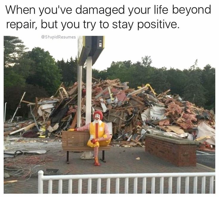 a clown sitting on a bench in front of a pile of rubble with the caption, when your co - workers really need your help but you still have 2 minutes left of your break