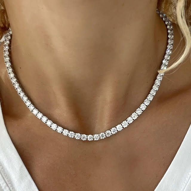 The most Incredible one! 30 Carat of top quality lab created diamond tennis necklace! 87 top quality, lab grown white diamonds, 4 prongs setting for each diamond, set as a tennis chain In 14k white gold. Sits so perfect on a women neck, for a luxurious amazing look, that no one can't miss! Double locking for extra safety. This tennis necklace will fit perfectly for the classic bride, special anniversary gift or round bday! Please contact us for size customization and gold color. Details: ⟡ 87 la Luxury Baguette Diamond Anniversary Necklace, Luxury Diamond Station Necklace Fine Jewelry, Tiffany Tennis Necklace, Diamond Tennis Necklace White Gold, Luxury Dazzling Diamond Necklace With Prong Setting, Luxury Brilliant Cut Lab Grown Diamond Necklaces, Luxury Baguette Diamond Necklaces For Women, Luxury Baguette Diamond Necklaces, Luxury White Gold Sterling Silver Tennis Necklace