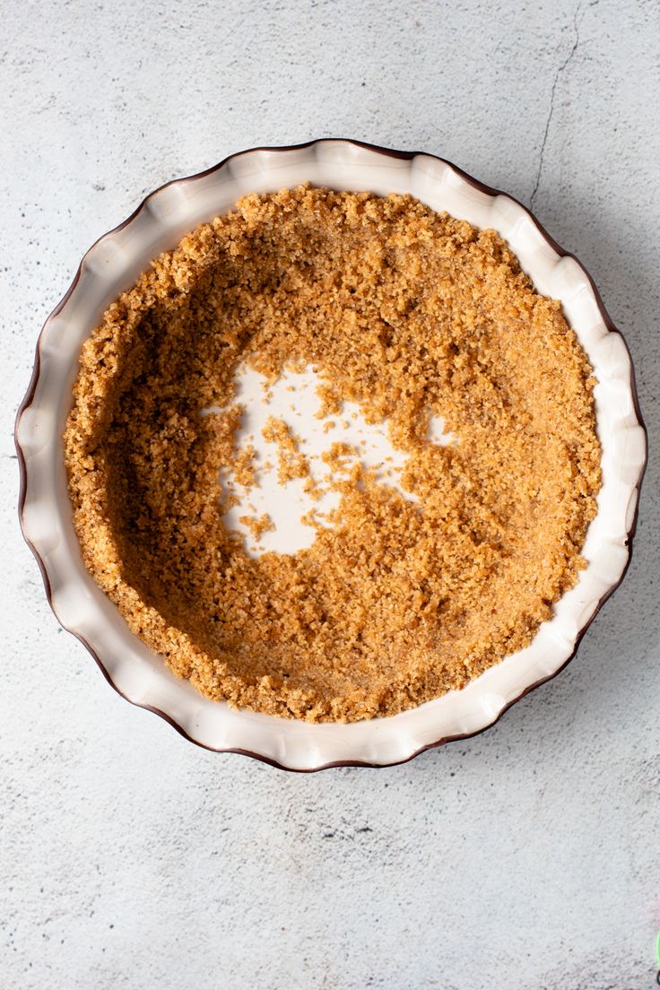 a pie crust in a bowl on a table