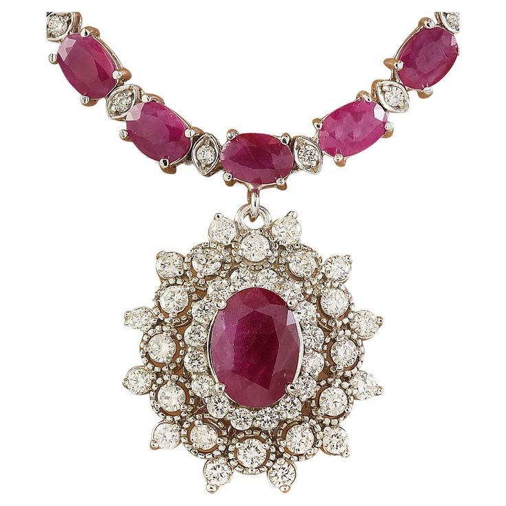 28.11 Carat Natural Ruby 14 Karat Solid White Gold Diamond Necklace Stamped: 14K Total Necklace Weight: 30 Grams Necklace Length: 18 Inches Center Ruby Weight: 2.31 Carat (9.00x7.00 Millimeters) Side Ruby WeighT 23.00 Carat (6.00x4.00 Millimeters) Diamond Weight: 2.80 Carat (F-G Color, VS2-SI1 Clarity) Face Measures: 23.45x21.65 Millimeters SKU: [600857] Ruby Diamond Necklace, Gold Ruby Necklace, Chanel Costume Jewelry, Ruby And Diamond Necklace, Luxury Necklace, Gold Diamond Necklace, Red Diamond, Red Gemstones, White Gold Necklaces